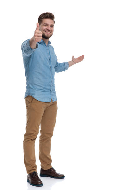 istock Positive casual man gesturing ok, presenting and smiling 1208364842