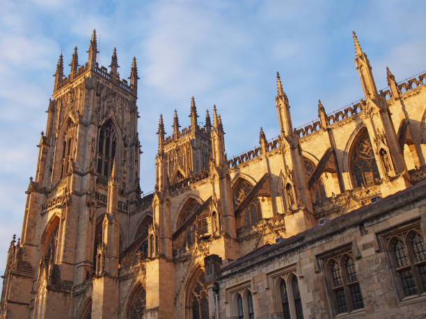 istock a side view of york minster in sunlight against a blue cloudy sky 1208365231