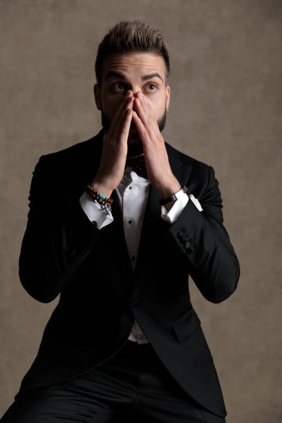 istock Surprised groom covering his mouth and gasping 1208366719