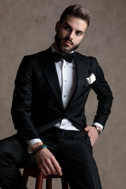 istock Curious groom looking away with his hand in his pocket 1208366957