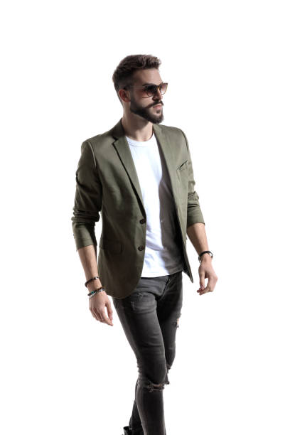istock Wondering fashion model wearing sunglasses, walking 1208367602