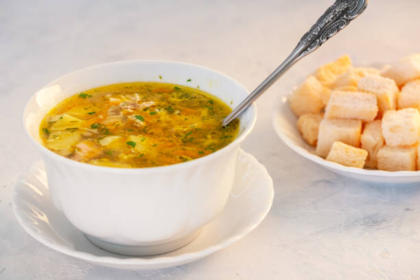istock Fragrant and delicious chicken soup with herbs and vegetables. 1208368416