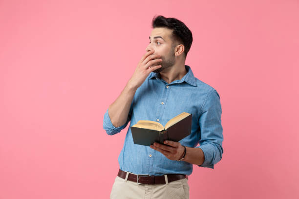 istock shocked casual guy holding hand to mouth 1208368664