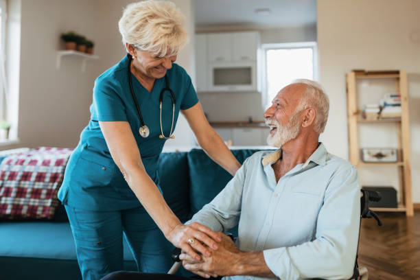 istock Professional experienced caregiver looking after her patient 1208371387