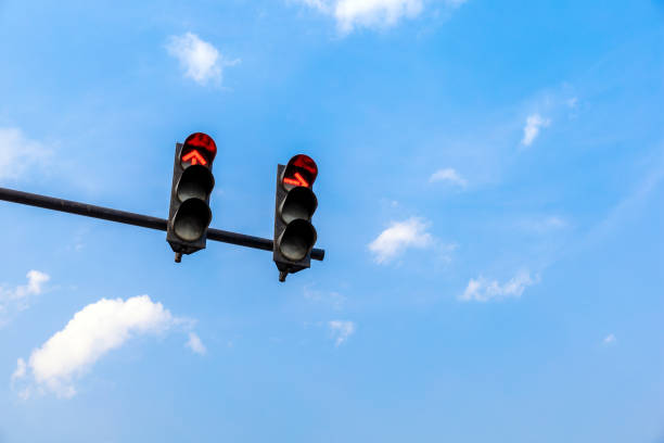 istock traffic light with red color on blue sky background 1208371968