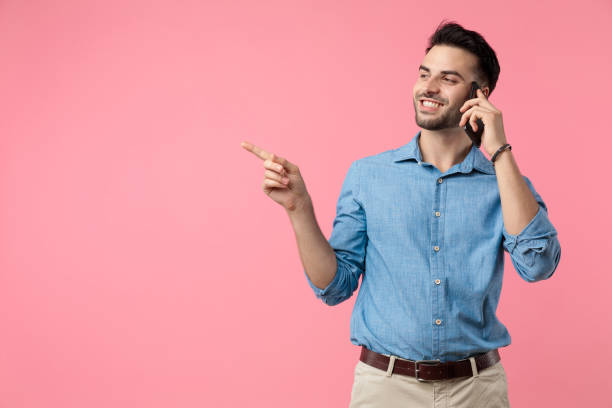 istock happy young casual guy talking on the phone 1208372425