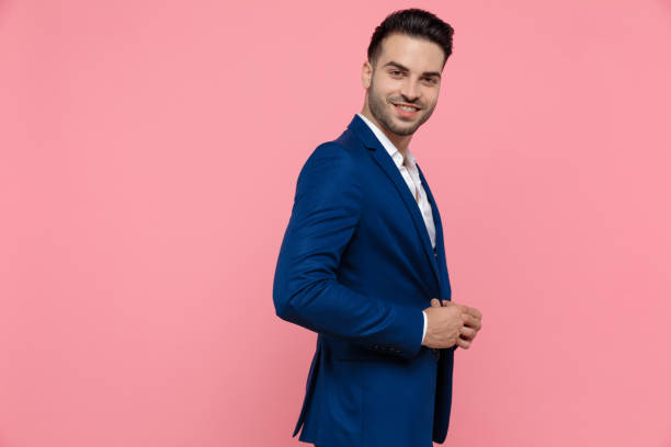 istock Side view of a cheerful businessman adjusting his jacket 1208372954