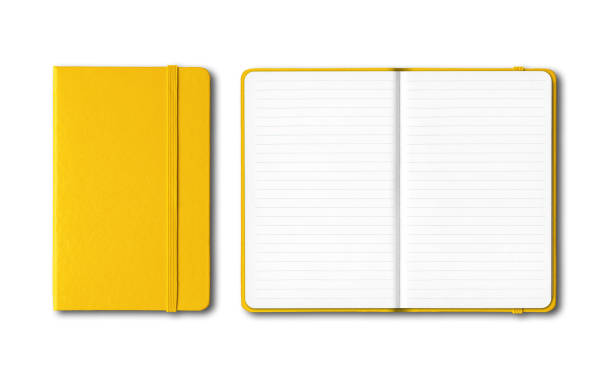 Yellow closed and open lined notebooks isolated on white stock photo