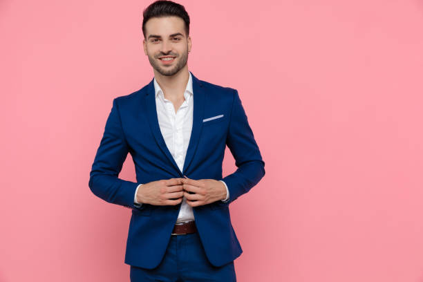 istock Handsome businessman unbuttoning his jacket and laughing 1208373951