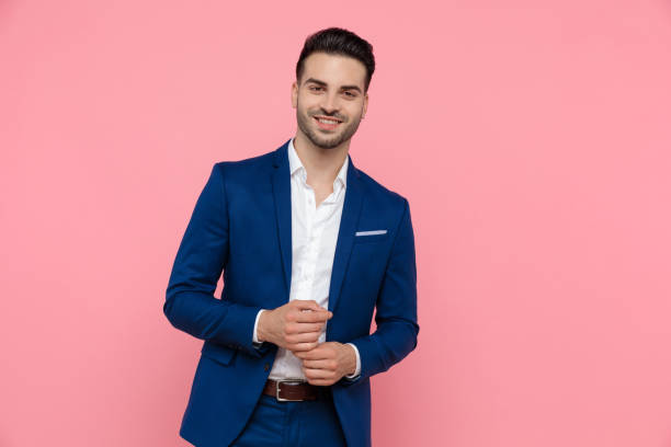 istock Cheerful businessman laughing while wearing blue suit 1208374082