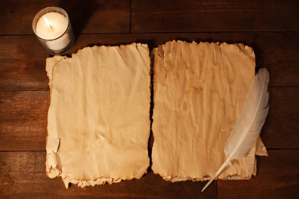 istock Magic letters, empty sheet of paper, feather, wooden brown table. 1208374446