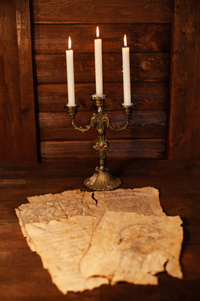 istock Bronze gilded candelabrum with three mustard candles 1208374484