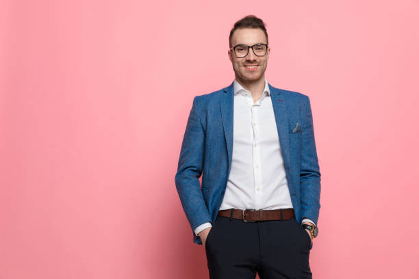 istock Cheerful smart casual man holding both hands in his pockets 1208375866