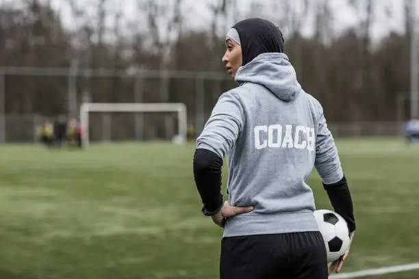 Photo of Beautiful Young Female Muslim Soccer Coach