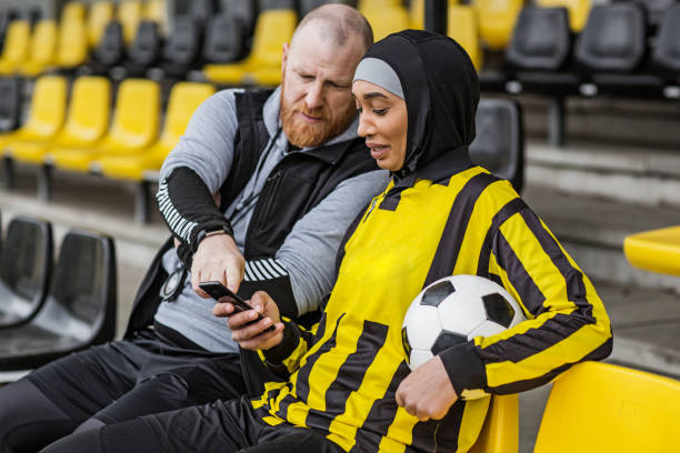 istock Beautiful Young Female Muslim Soccer Player 1208376347