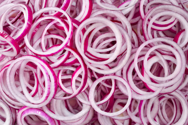 istock Onion rings as a background. Top view. 1208376577