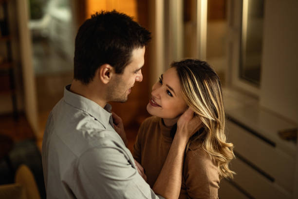 istock Young happy couple in love looking at each other. 1208381582