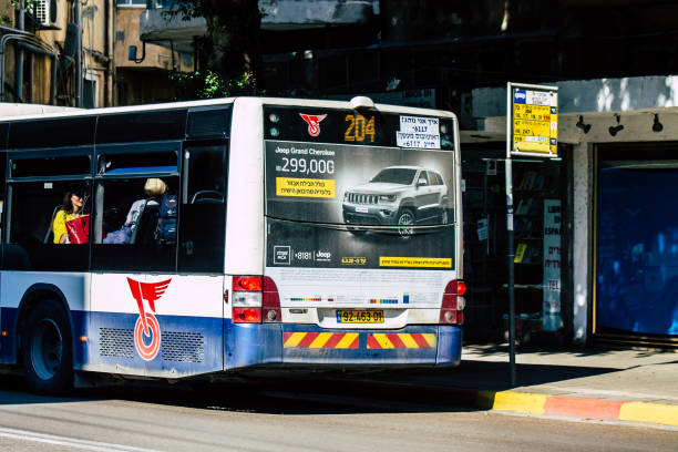 Tel Aviv Israel February 21, 2020 View of a traditional Israeli public city bus rolling in the streets of Tel Aviv in the afternoon
