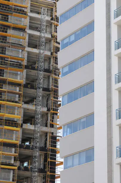 Construction of a new Skyscraper against a new modern office building