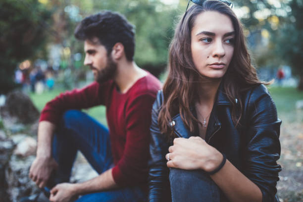 Broken heart Young couple in the park feeling unhappy relationship breakup stock pictures, royalty-free photos & images