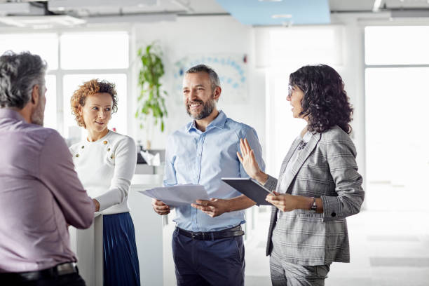 istock Smiling entrepreneurs are discussing in meeting 1208389386