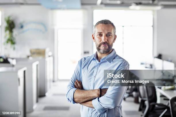 Confident Male Professional With Arms Crossed Stock Photo - Download Image Now - Men, Portrait, Business