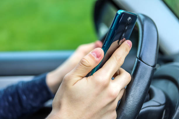 istock phone behind the wheel 1208391760