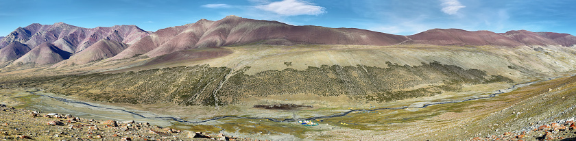 Panoramic view of Colorful mountains and Nimaling campground along Markha Valley trek, Ladakh, northern India.