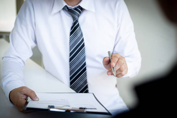 istock Business people hold resume documents, interviews for the work experience of young men applying as financial accountants for the company, Job interview and Job applicationConcept. 1208392420