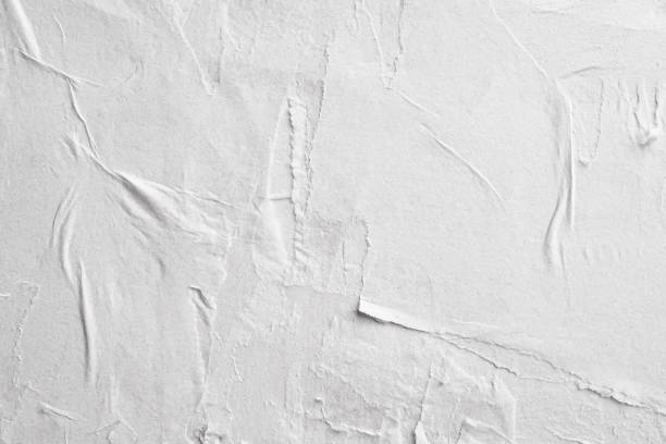 istock Blank white crumpled and creased paper poster texture background 1208392690