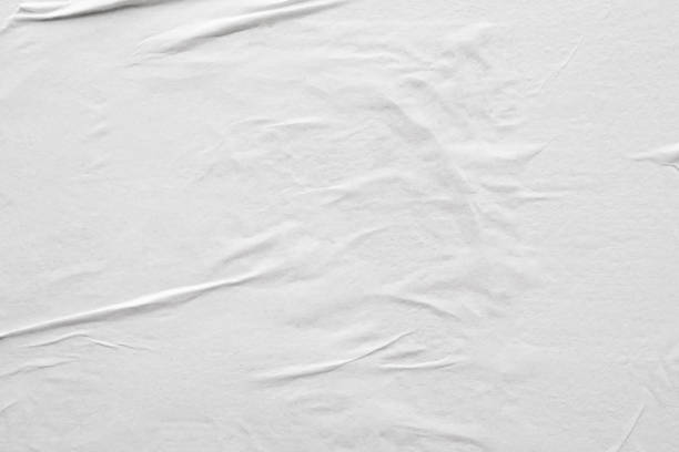 istock Blank white crumpled and creased paper poster texture background 1208392718