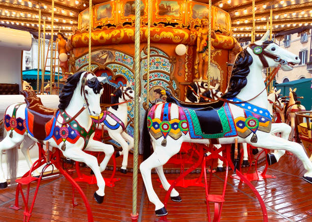 istock white painted horses in a carousel decorated with lights and gold 1208394016