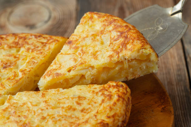 istock Spanish omelette with potatoes and onion, typical Spanish cuisine. Tortilla espanola. Rustic dark background 1208394031