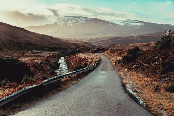 Looking down the A897 road to the bridge over the Kildonan Burn at Baile an Or, Kildonan, Sutherland, Scotland. This was the scene of a gold rush in 1868 and which lasted for one year. The name Baile an Or, is gaelic for Town of Gold.
