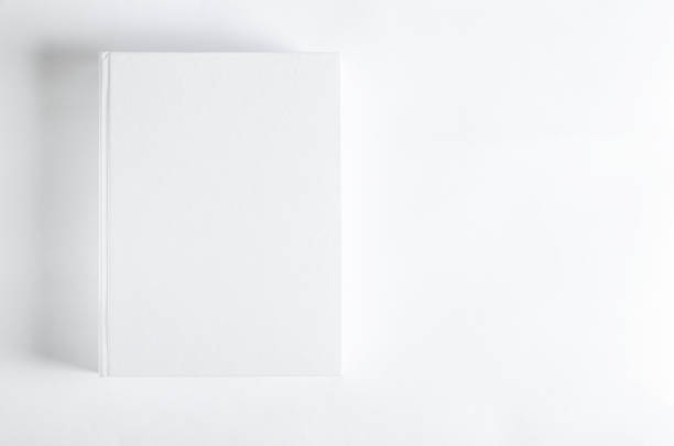 istock Mockup of closed blank square book at white textured paper background 1208395443