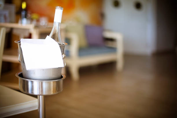 Bottle of white wine in ice bucket in restarant