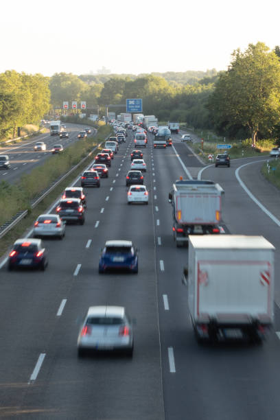 istock traffic on a german highway, coudy sky 1208395917