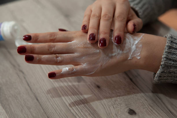 istock woman hand cream 1208395987