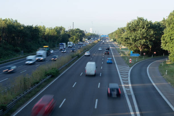 istock traffic on a german highway, coudy sky 1208396108