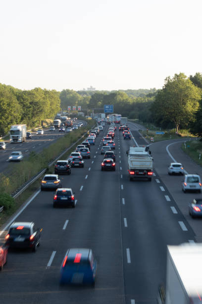 istock traffic on a german highway, coudy sky 1208396258