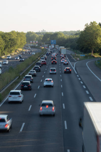 istock traffic on a german highway, coudy sky 1208396839