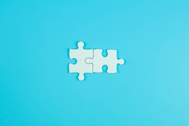 istock Jigsaw puzzle pieces on blue background with copy space for text. solutions, mission, successful, goals, cooperation, partnership and strategy concept 1208396975