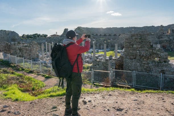 istock Traveler taking photos on her phone 1208397187