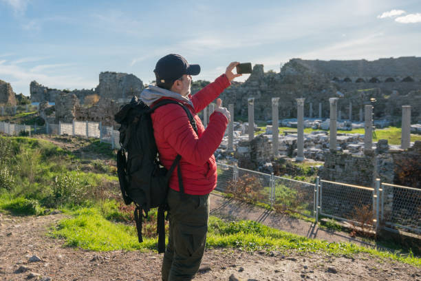 istock Traveler taking photos on her phone 1208397554