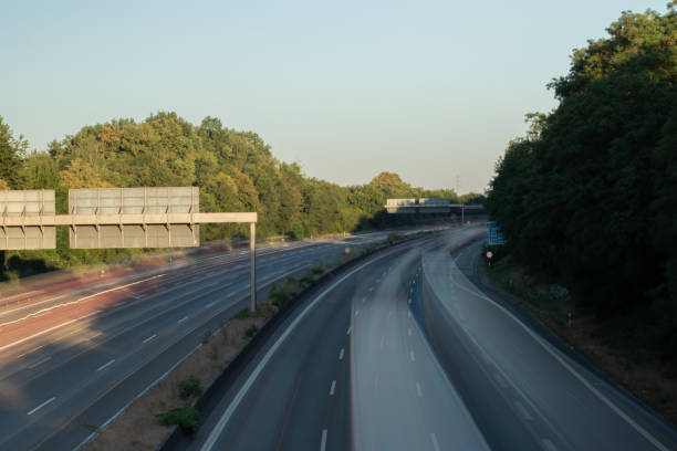 istock traffic on a german highway, coudy sky 1208399234