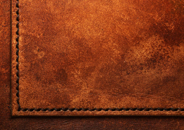istock Dark brown vegetable tanned leather closeup, showing full frame grain texture 1208399771