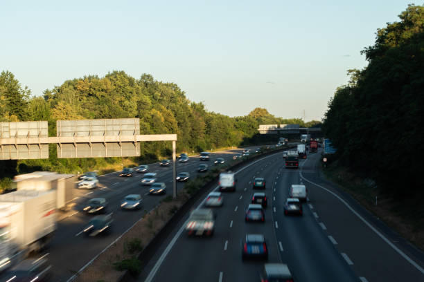 istock traffic on a german highway, coudy sky 1208399811