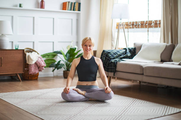 istock Two young women practicing yoga together 1208403862