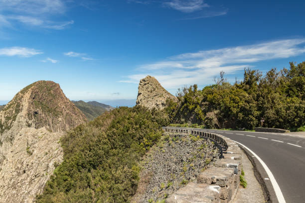 Panoramic view of Rocks - Los Roques in La Gomera island. A volcanic plug, also called a volcanic neck or lava neck, is a volcanic object created when magma hardens within a vent on an active volcano. vista panorámica de las rocas - los roques en la isla de la gomera. un tapón volcánico, también llamado cuello volcánico o cuello de lava, es un objeto volcánico creado cuando el magma se endurece dentro de un respiradero en un volcán activo