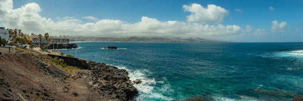 istock Extra large panorama from La Isleta an warm sunny day with briht blue sky and white clouds. Las Palmas, Las Canteras beach, Gran Canaria 1208408189